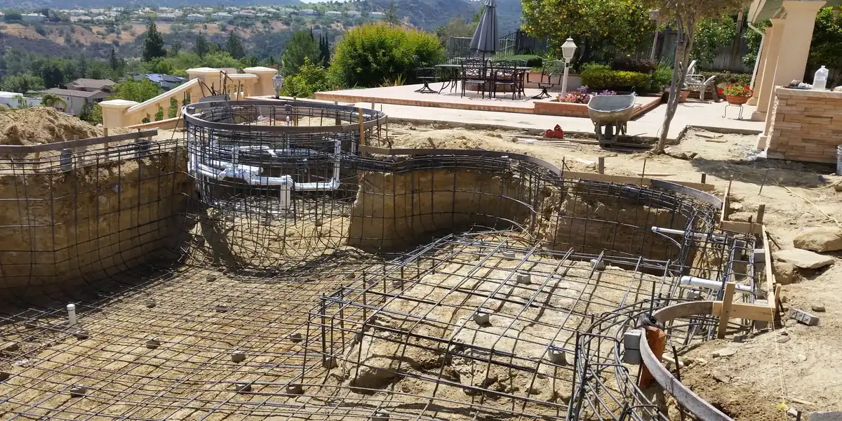 Pool remodeling project in Beverly Hills with new deck and waterfall